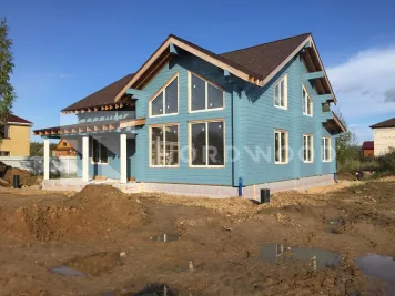 Покраска стен дома из клееного бруса площадью 215 кв. м. фото 2 - NORDWOOD